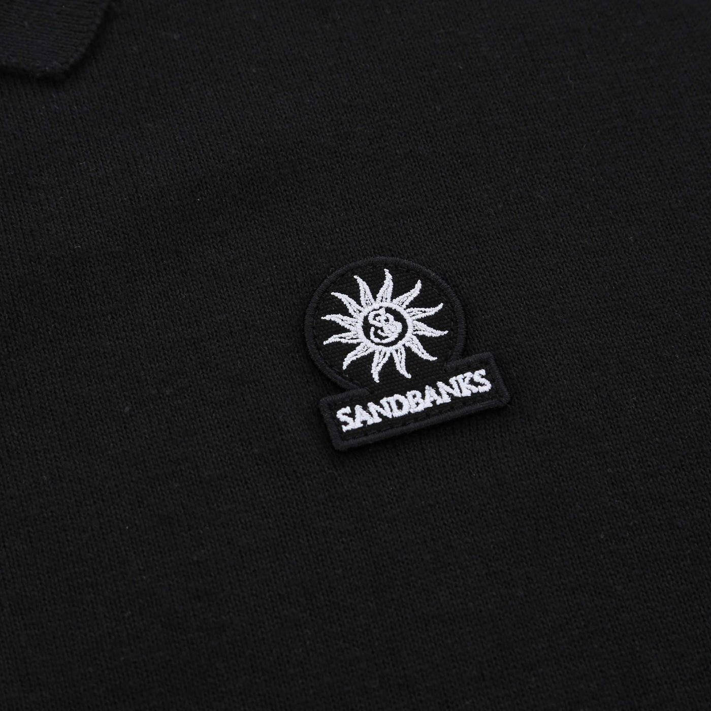 Sandbanks Zip Up Knitted Polo Shirt in Black Logo